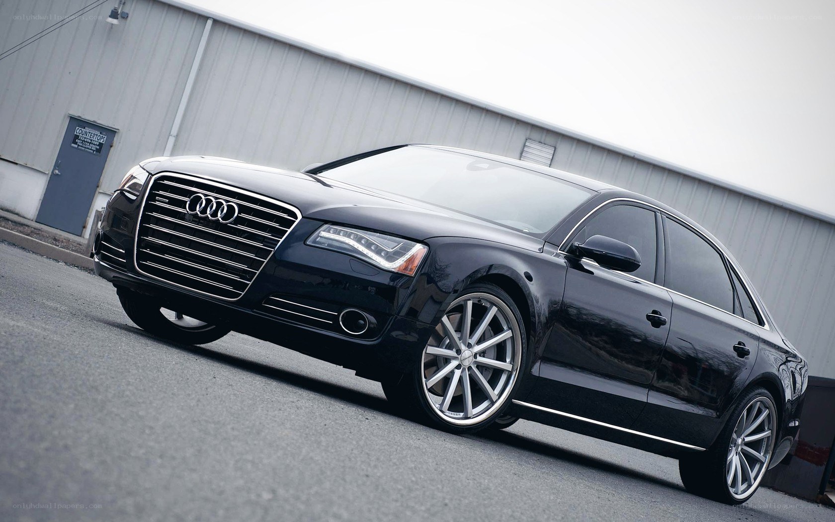 black audi sedan parked outside