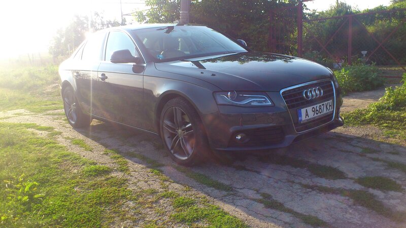 Black Audi Sedan — Serene, Sunset