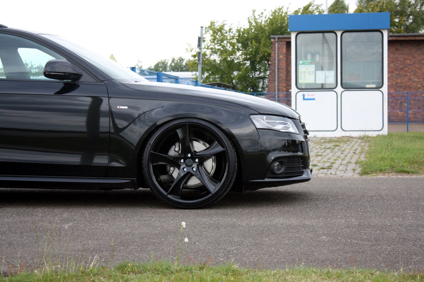 black audi with custom wheels