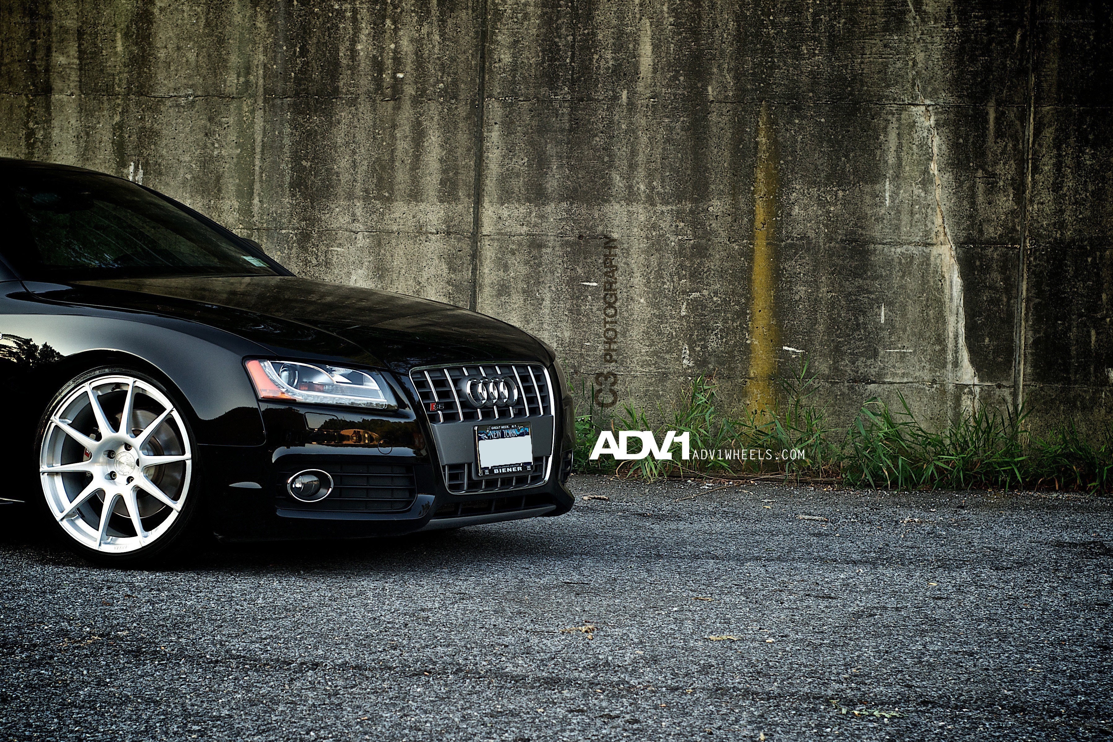 black audi with custom wheels