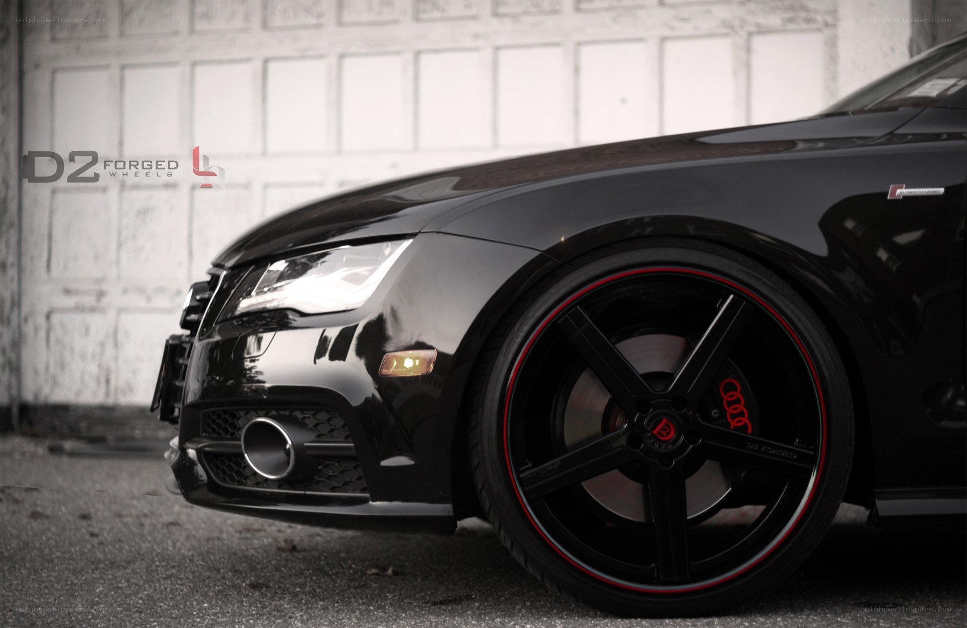 black audi with custom wheels