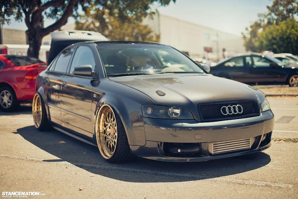 black audi with gold wheels
