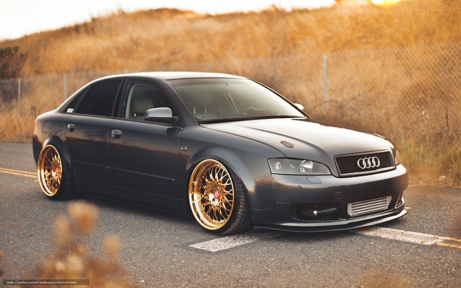black audi with gold wheels