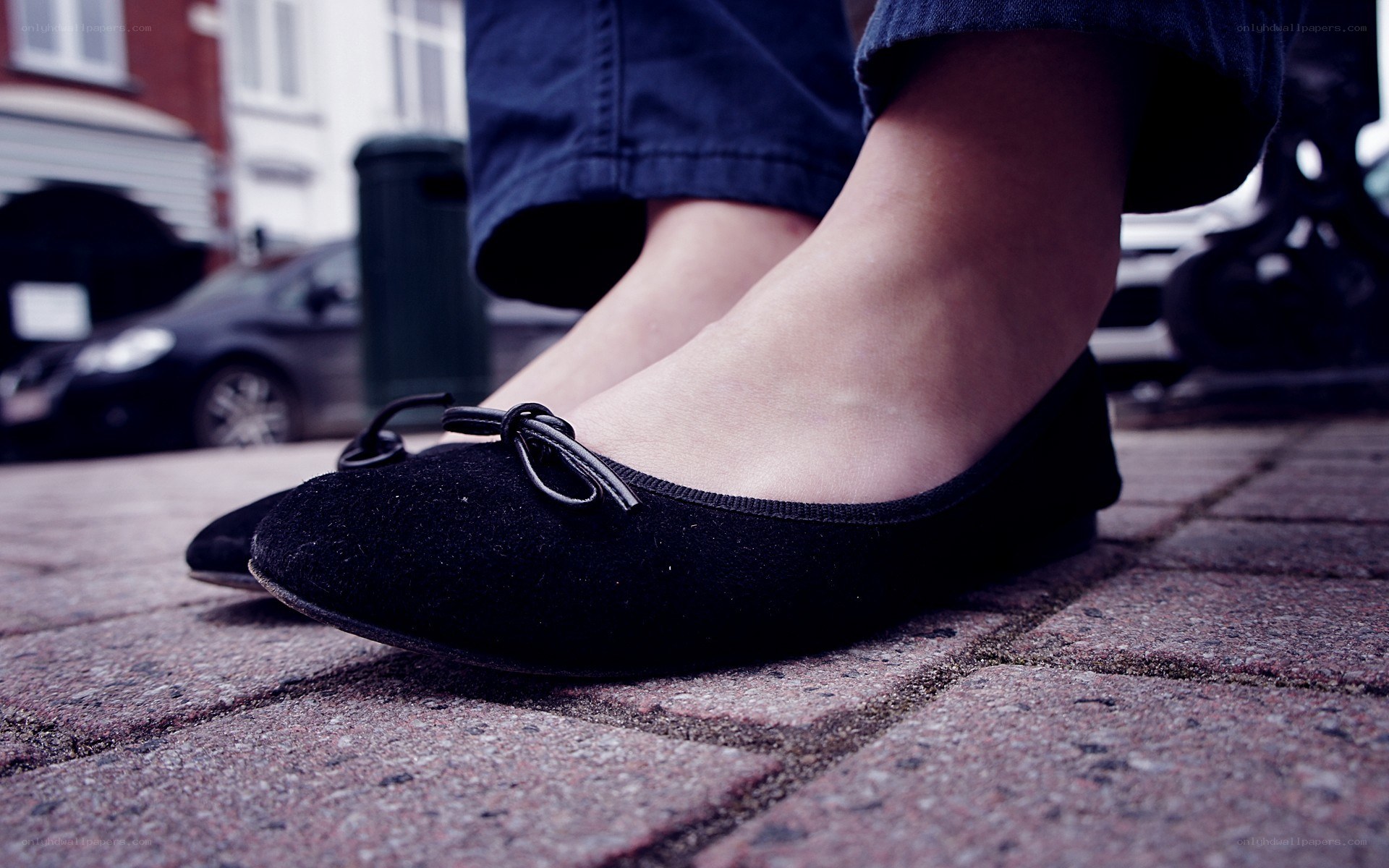 black ballet flats on pavement