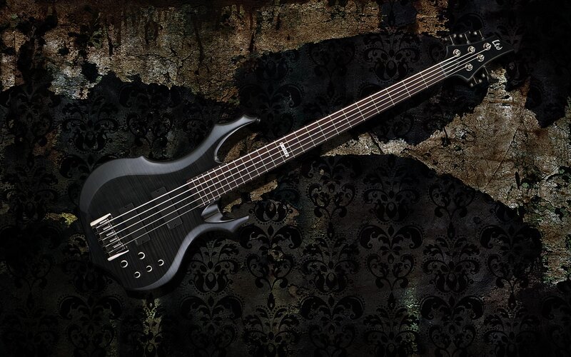 black bass guitar on textured background