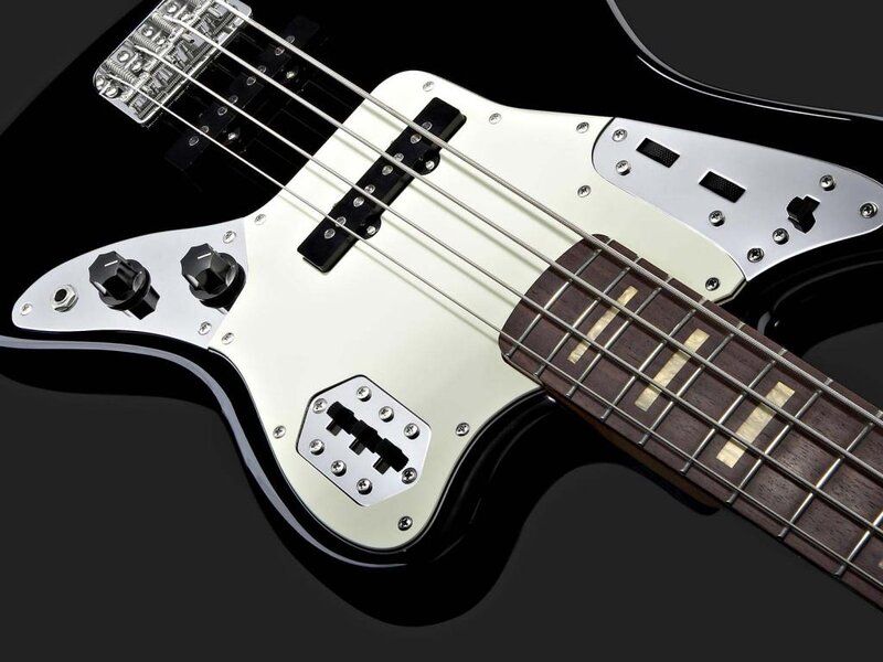 black bass guitar with white pickguard