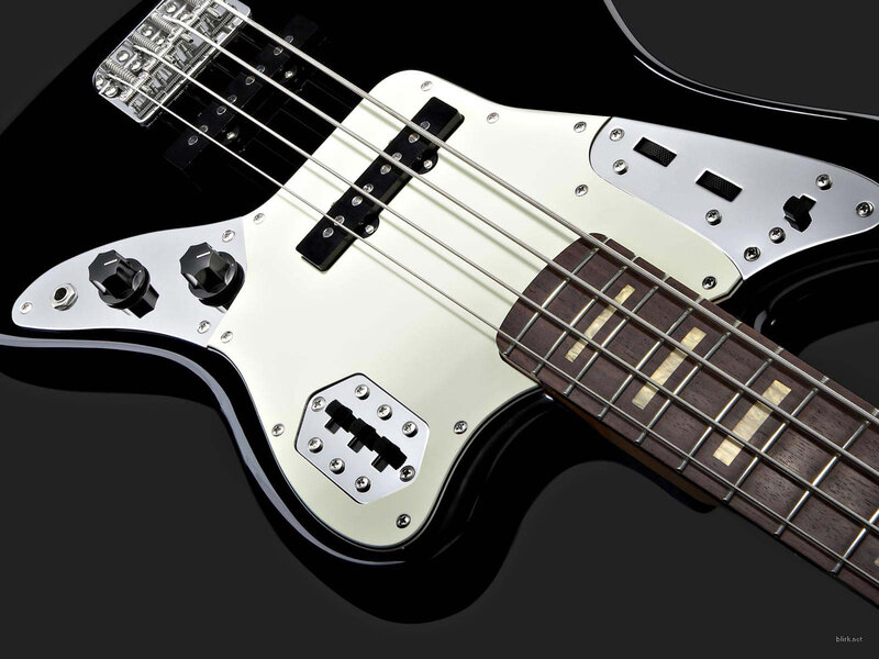 black bass guitar with white pickguard
