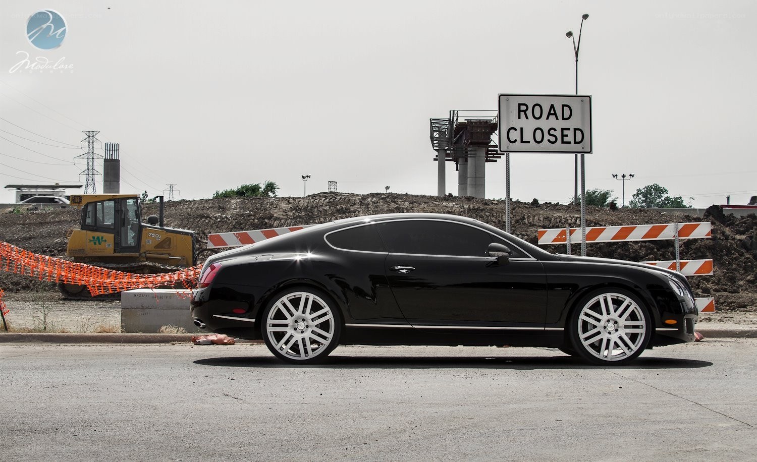 Black Bentley at construction site