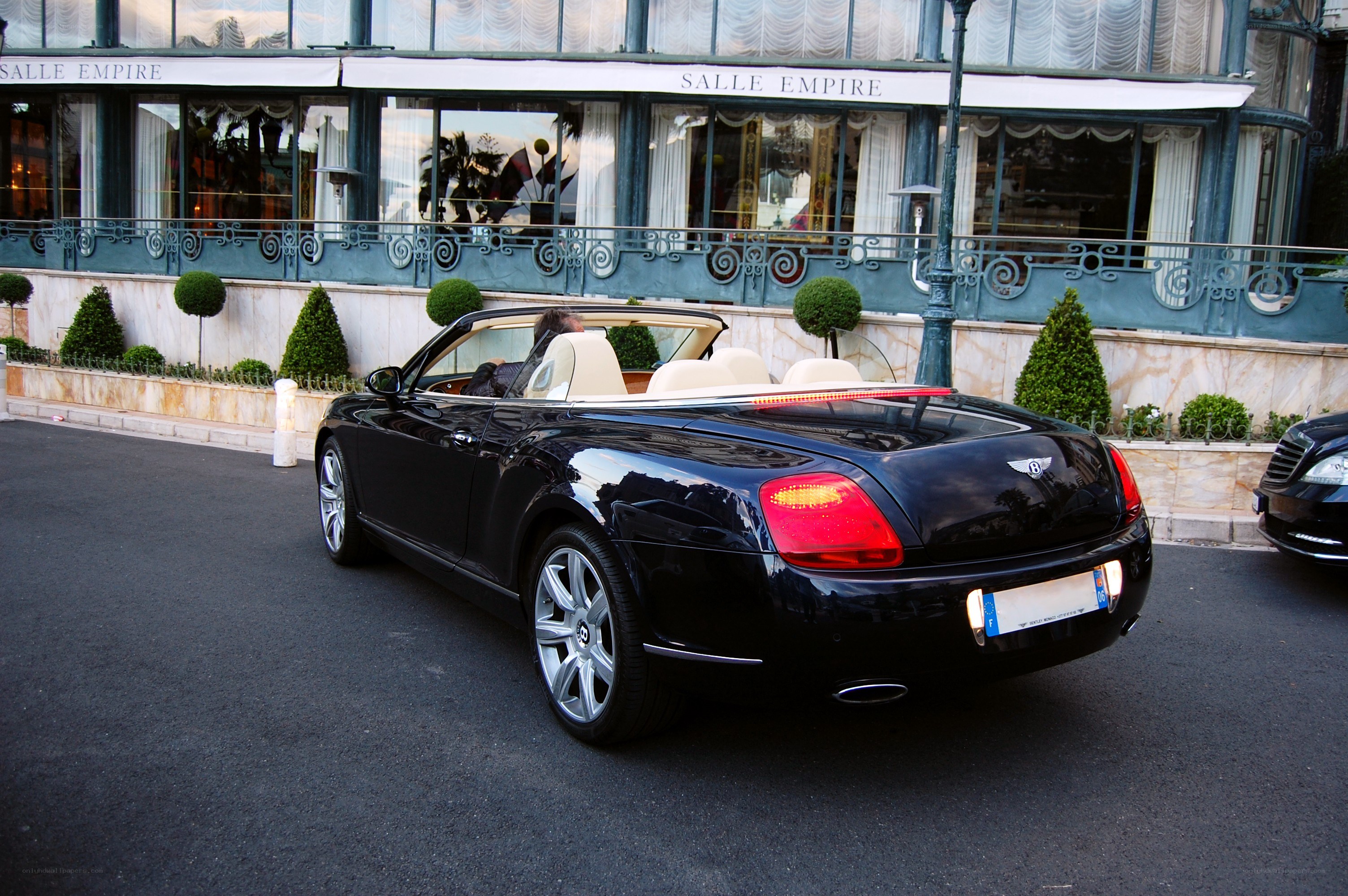 Black Bentley convertible on street