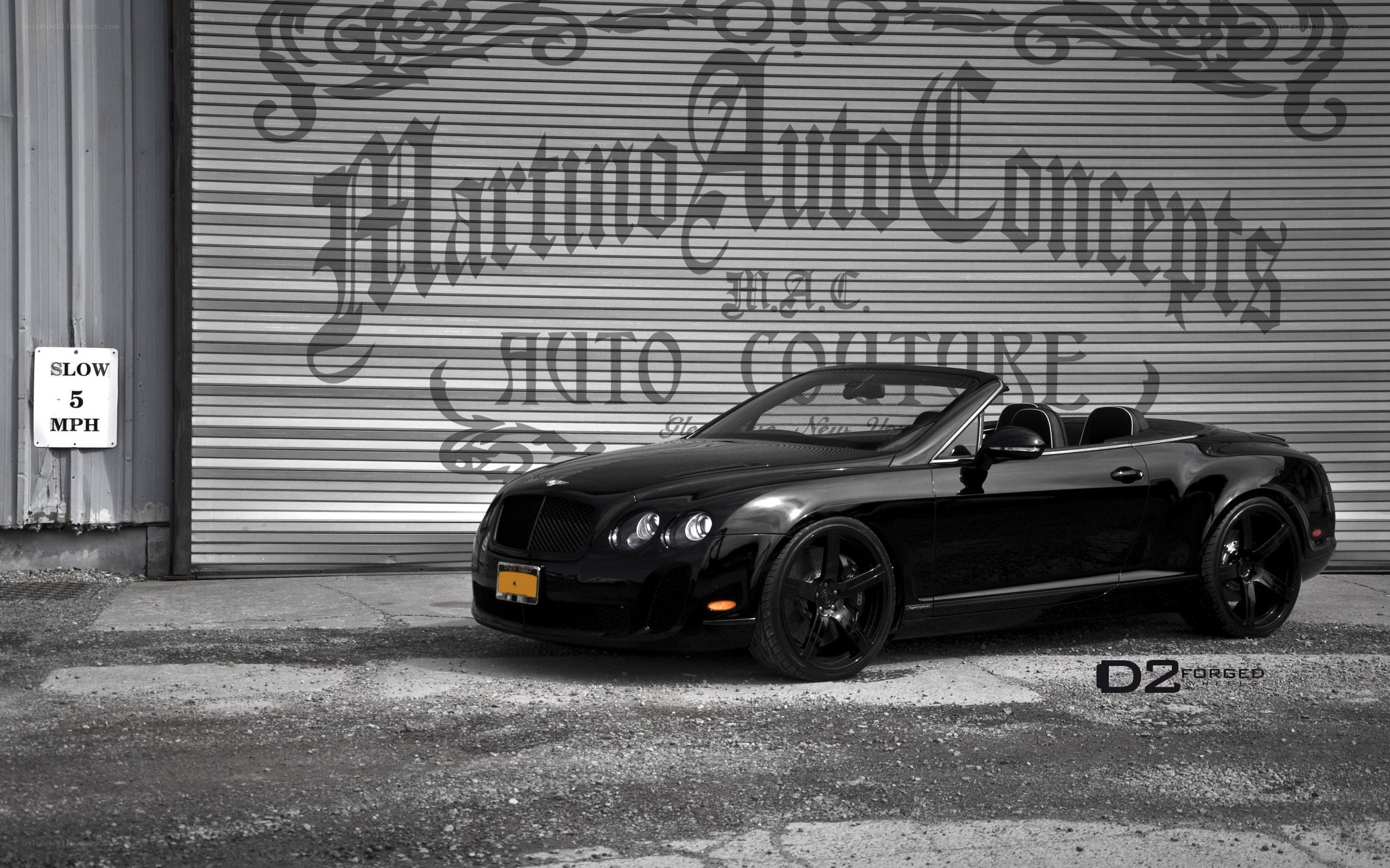 Black Bentley convertible parked