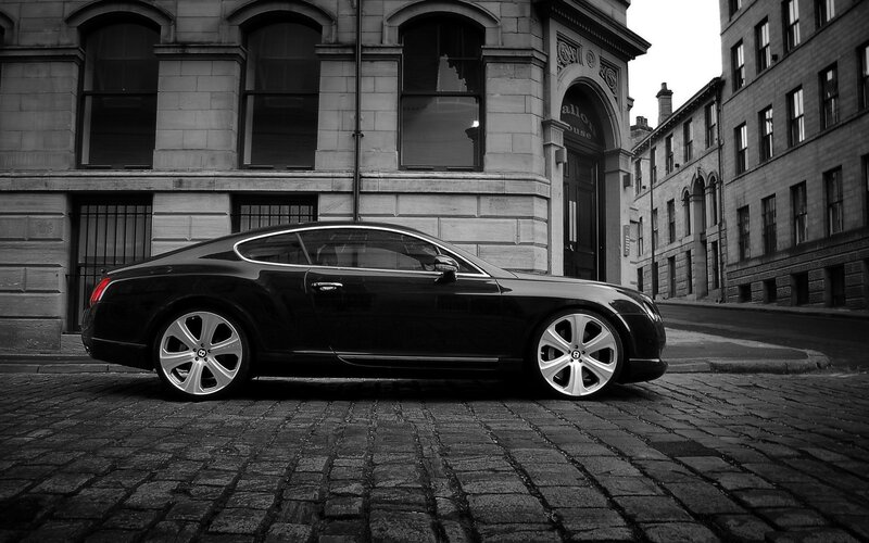 Black Bentley Coupe — Dramatic, Photograph, Building, Cobblestone Street, Windows