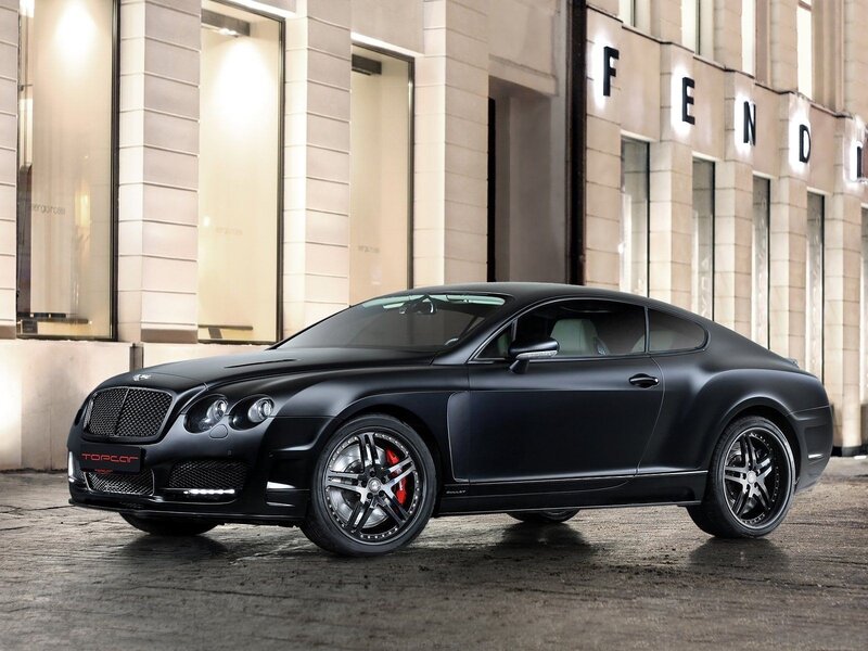 Black Bentley coupe on city street