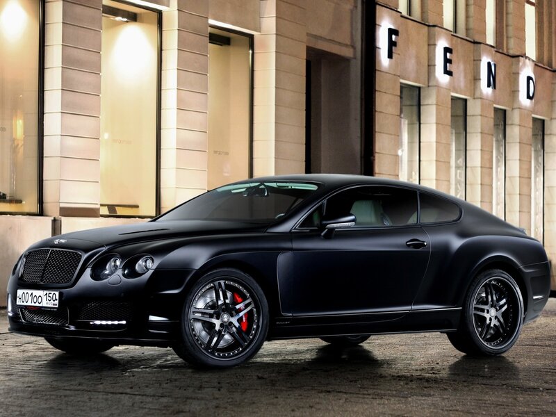 Black Bentley coupe on city street
