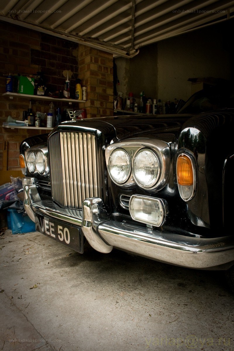 Black Bentley in a garage