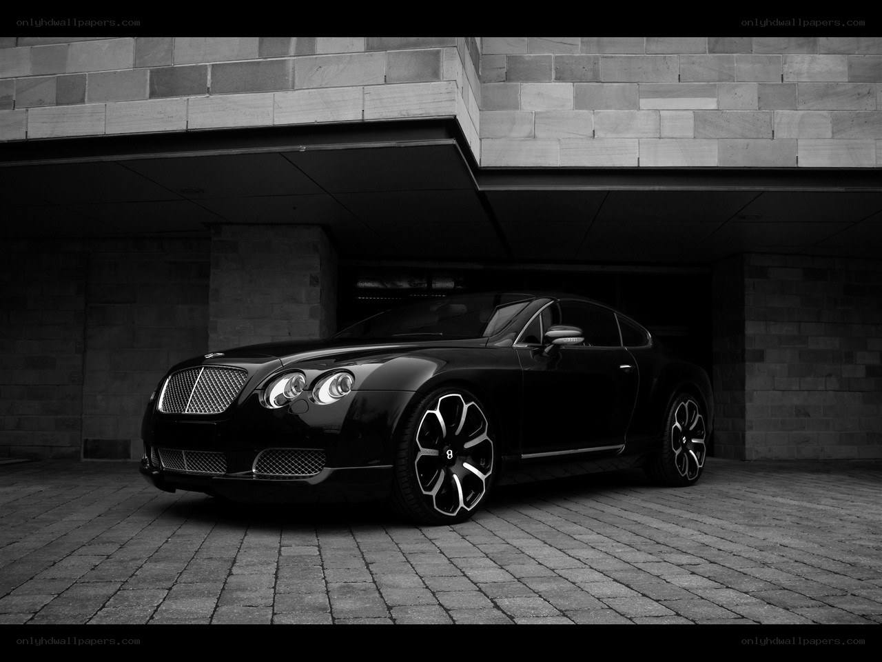 Black Bentley in a garage