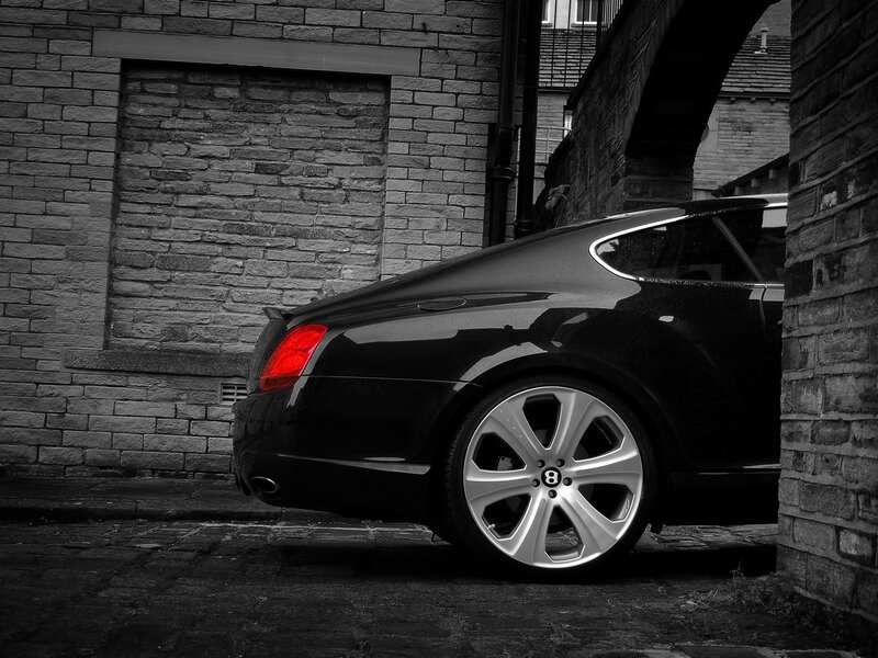 Black Bentley in alleyway