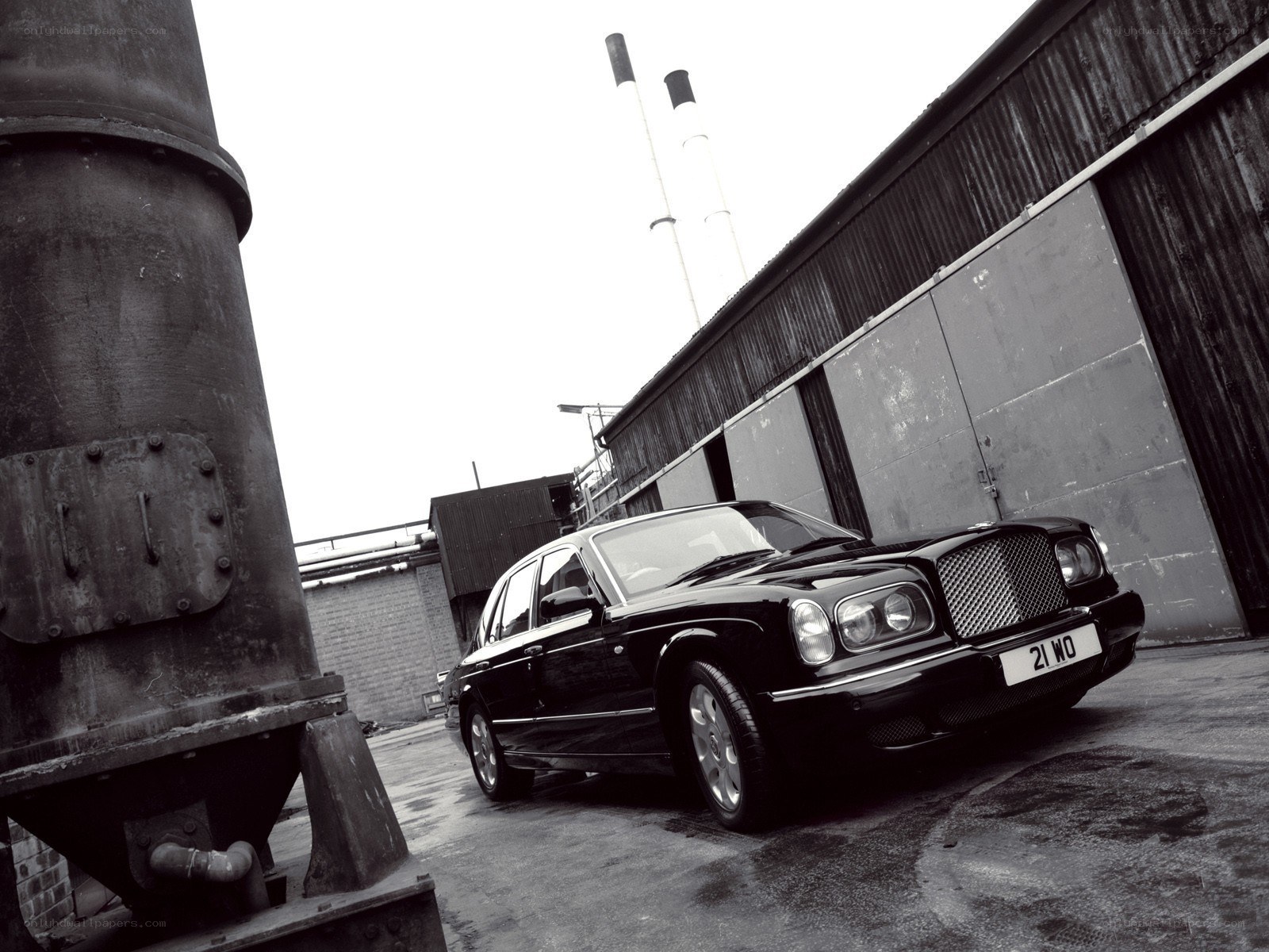 Black Bentley in industrial setting