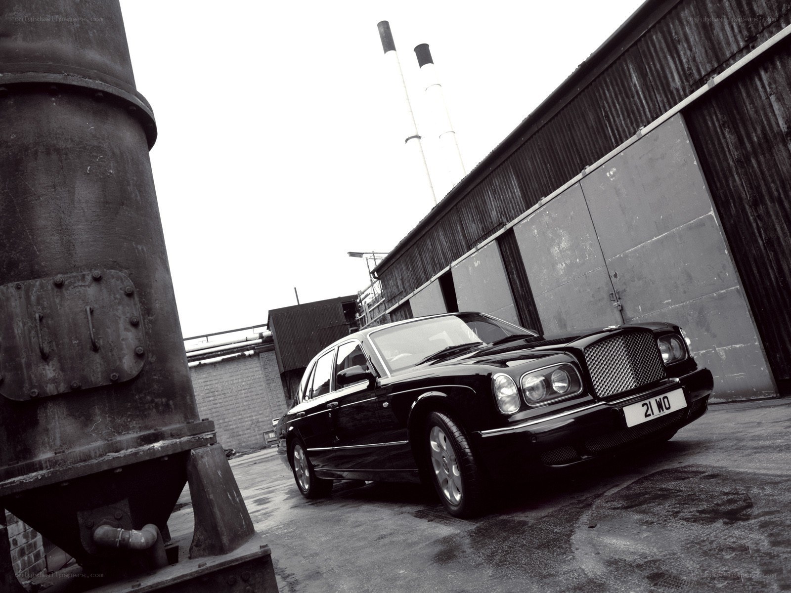Black Bentley in industrial setting