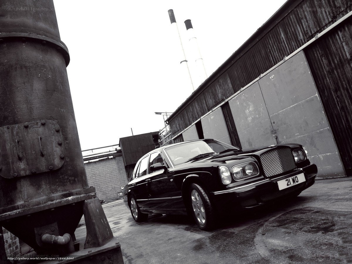 Black Bentley in industrial setting