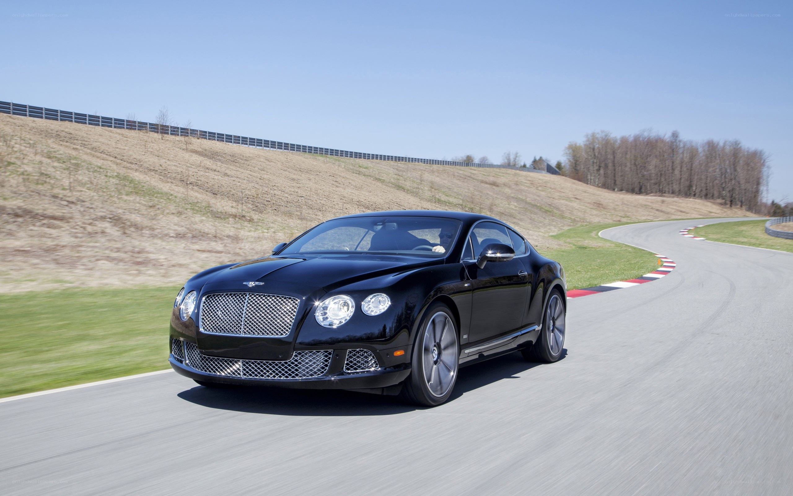 Black Bentley on a racetrack