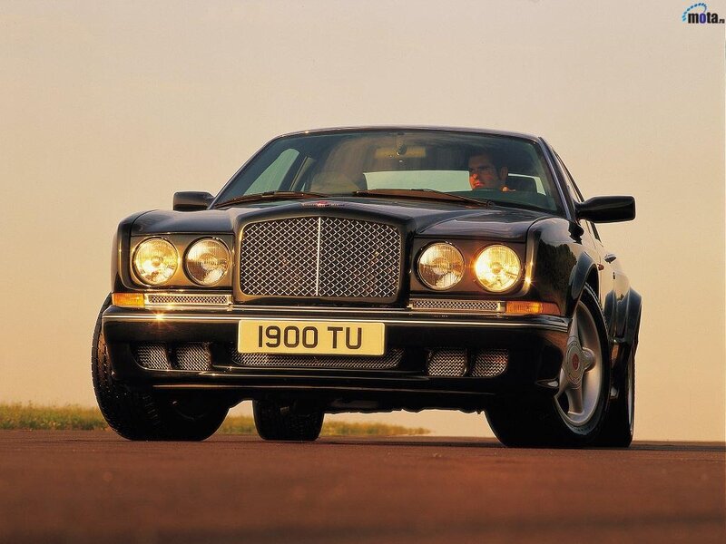Black Bentley on a road