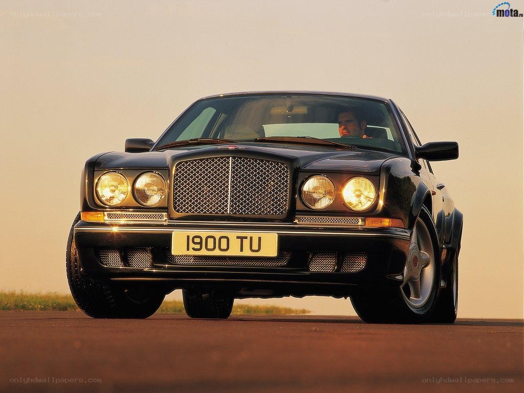 Black Bentley on a road