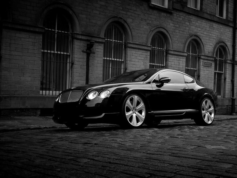 Black Bentley on cobblestone street