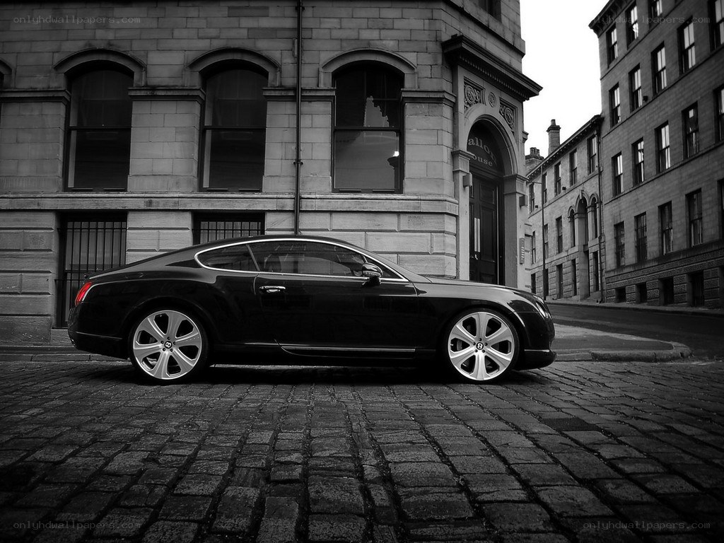 black bentley on cobblestone street