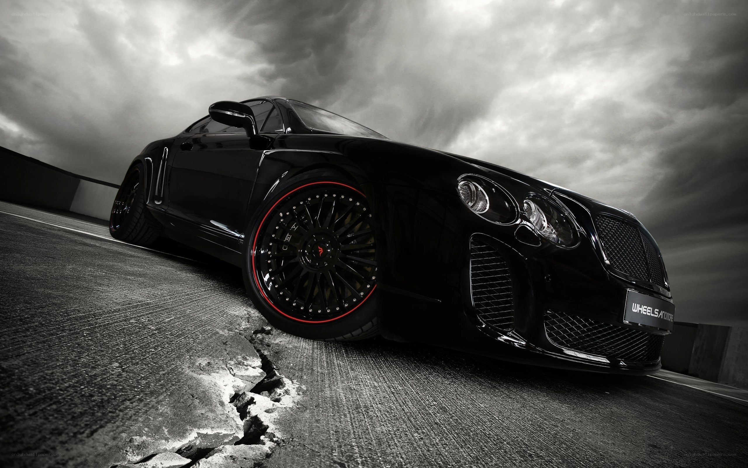 Black Bentley on cracked road