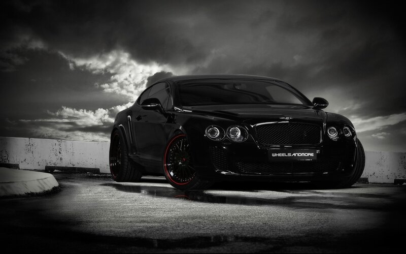 Black Bentley on wet pavement