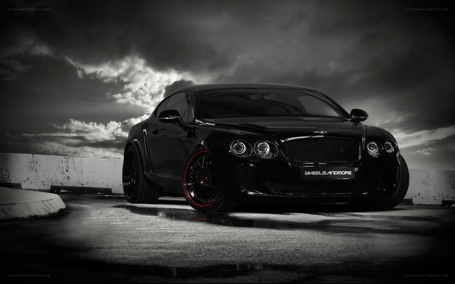 Black Bentley on wet pavement