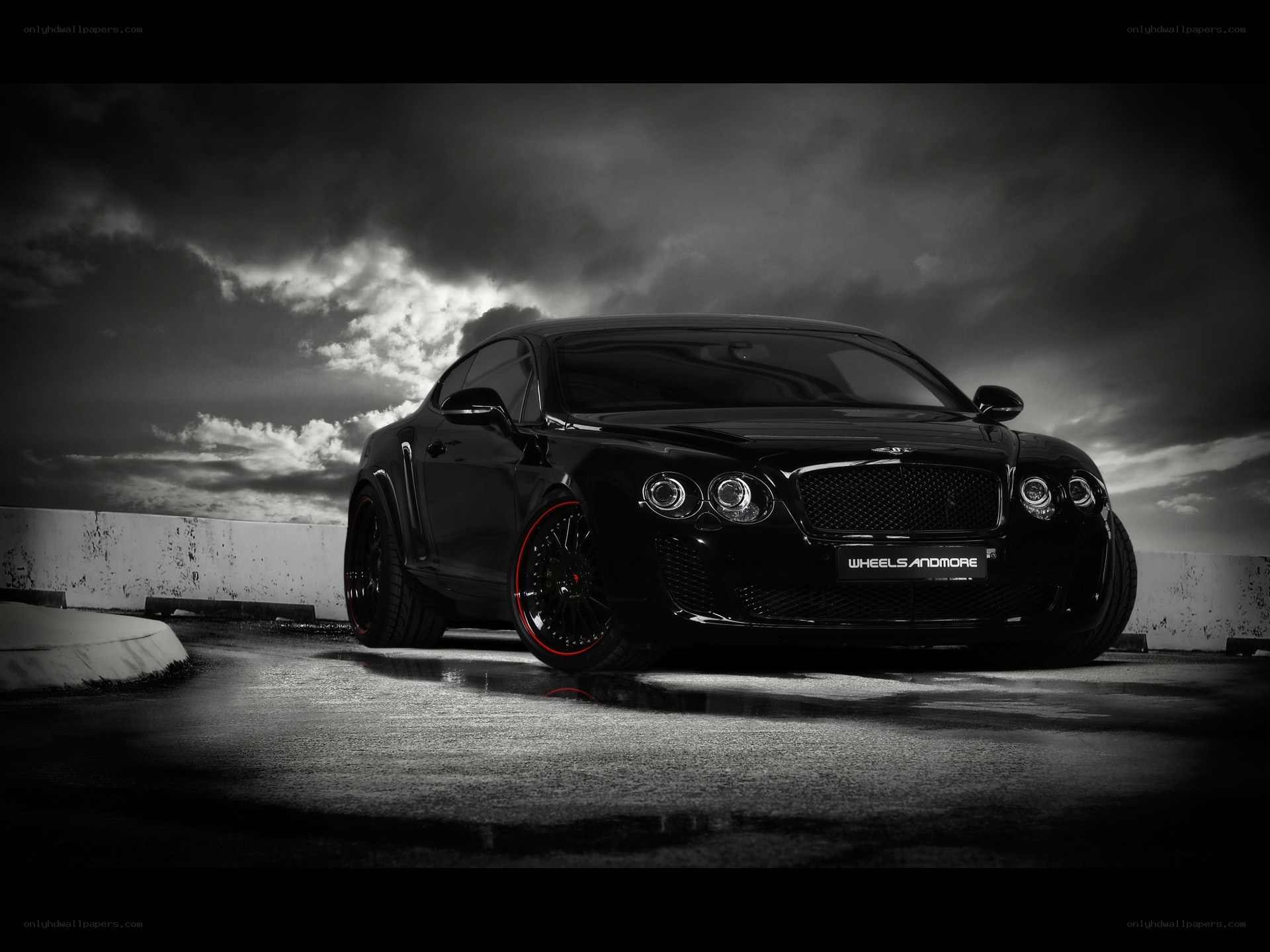 Black Bentley on wet pavement
