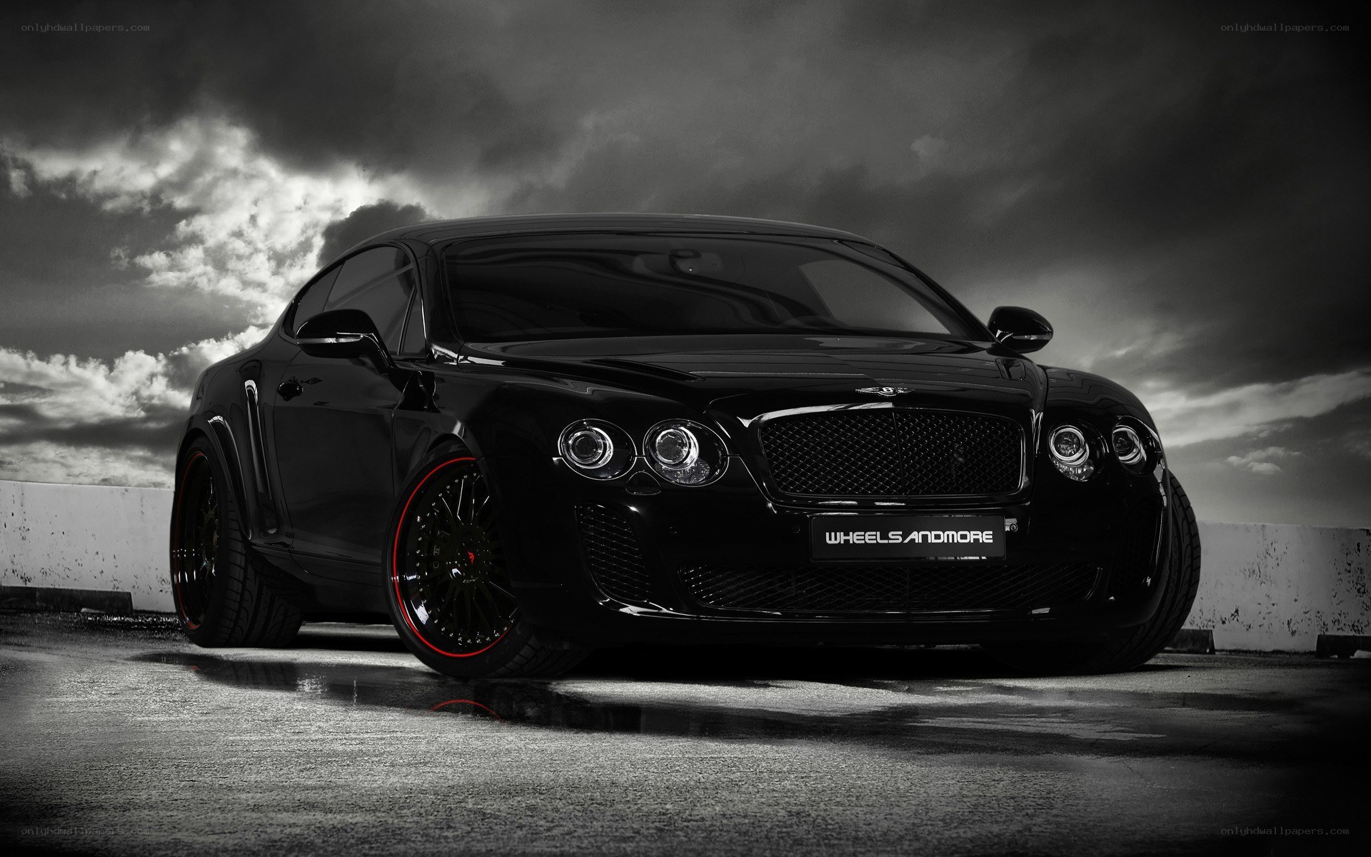 black bentley on wet pavement