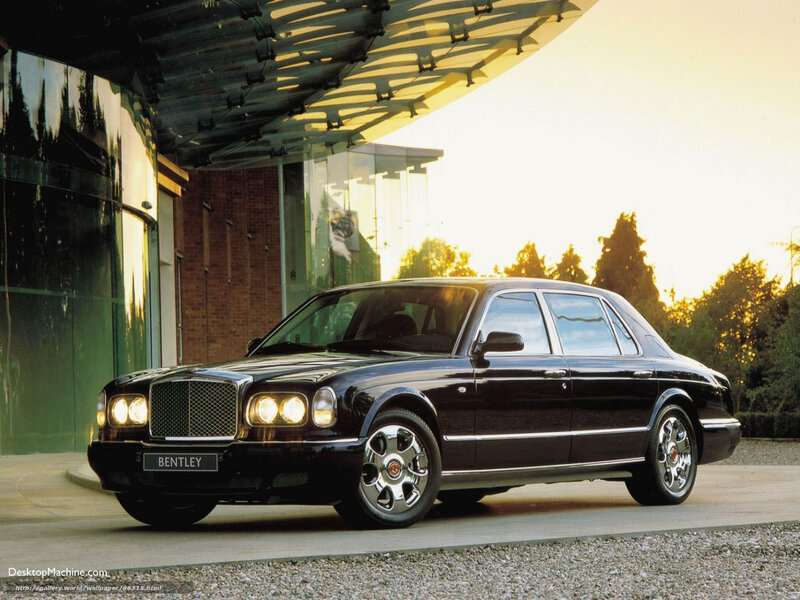 Black Bentley parked at building