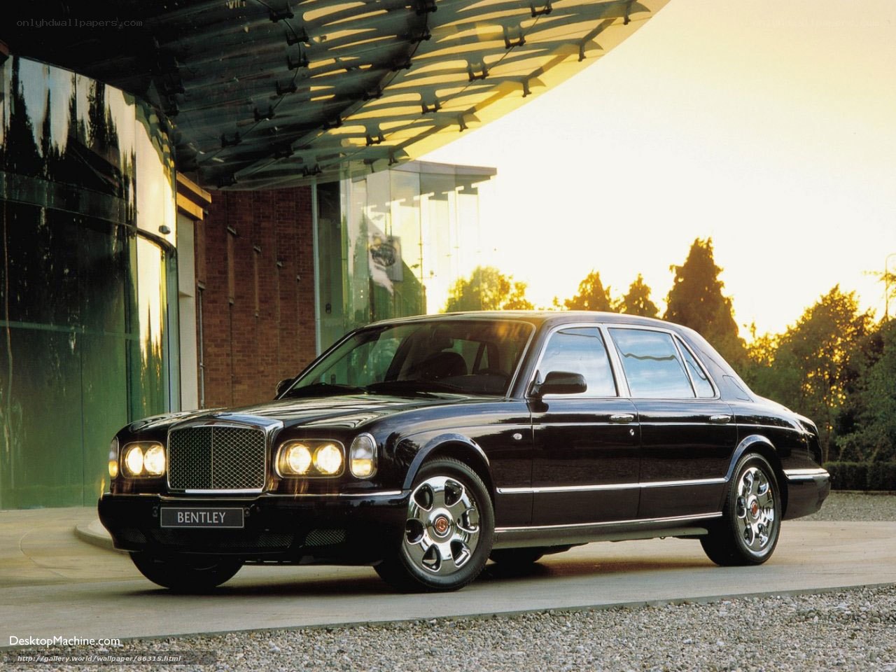 Black Bentley parked at building
