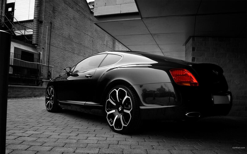 Black Bentley parked in alley
