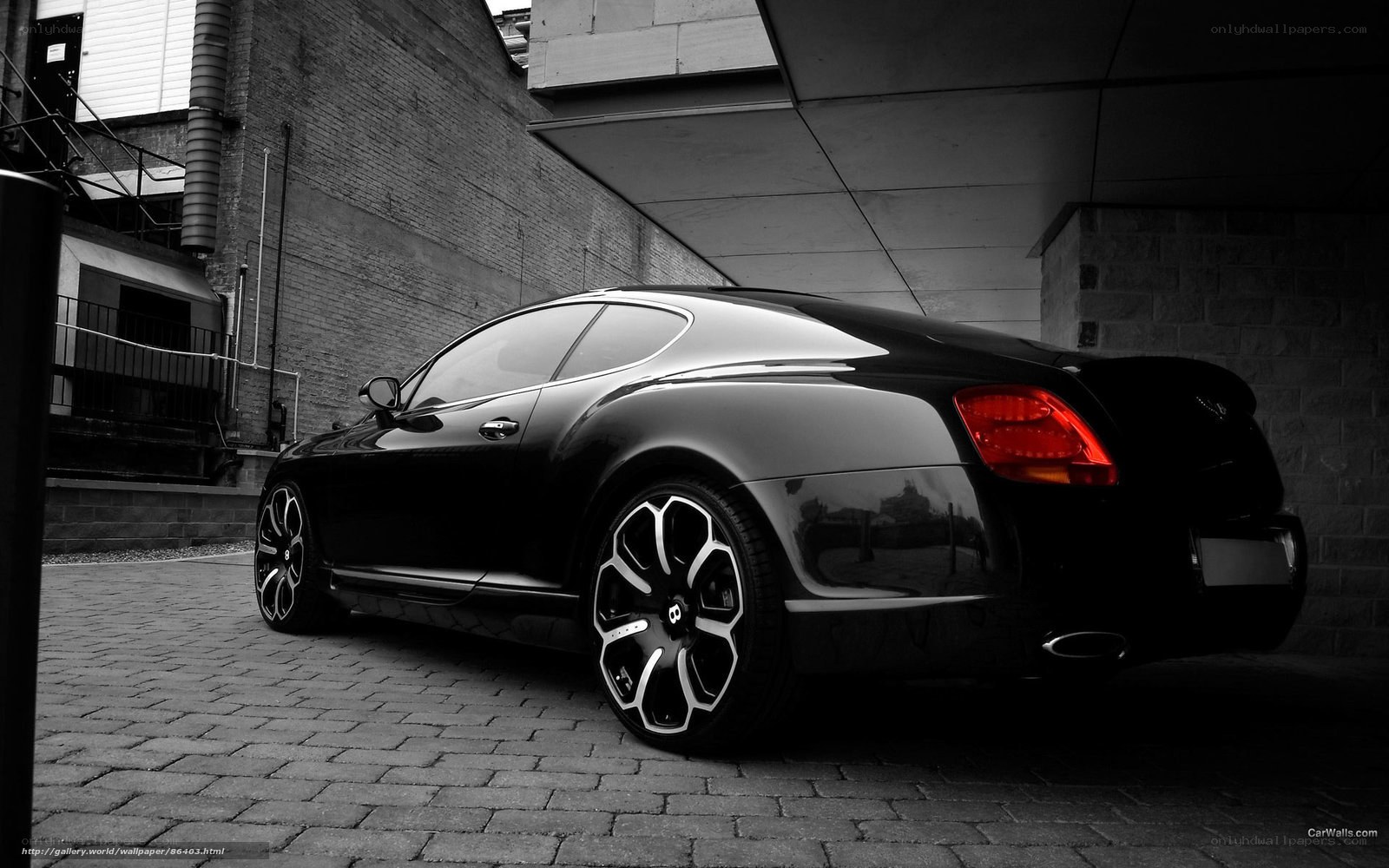 Black Bentley parked in alley