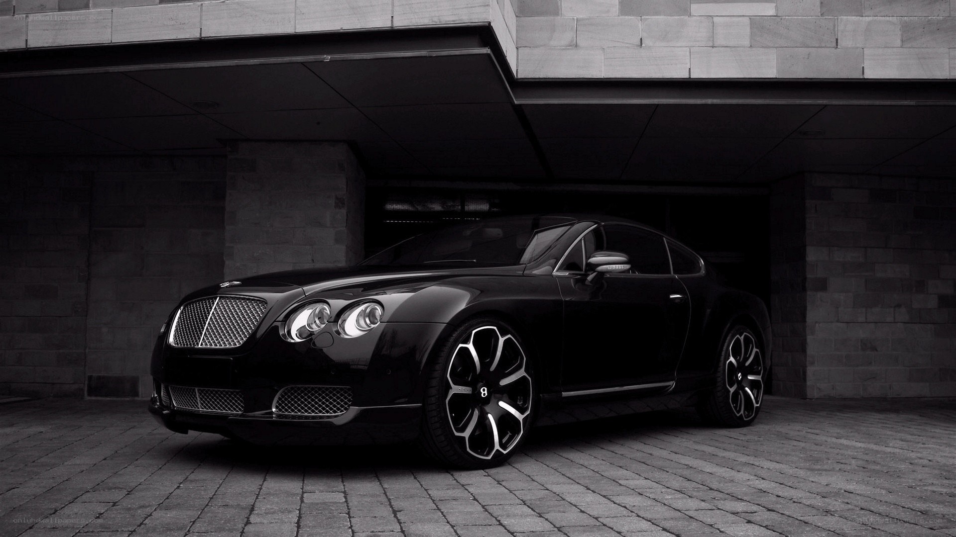 Black Bentley parked in garage