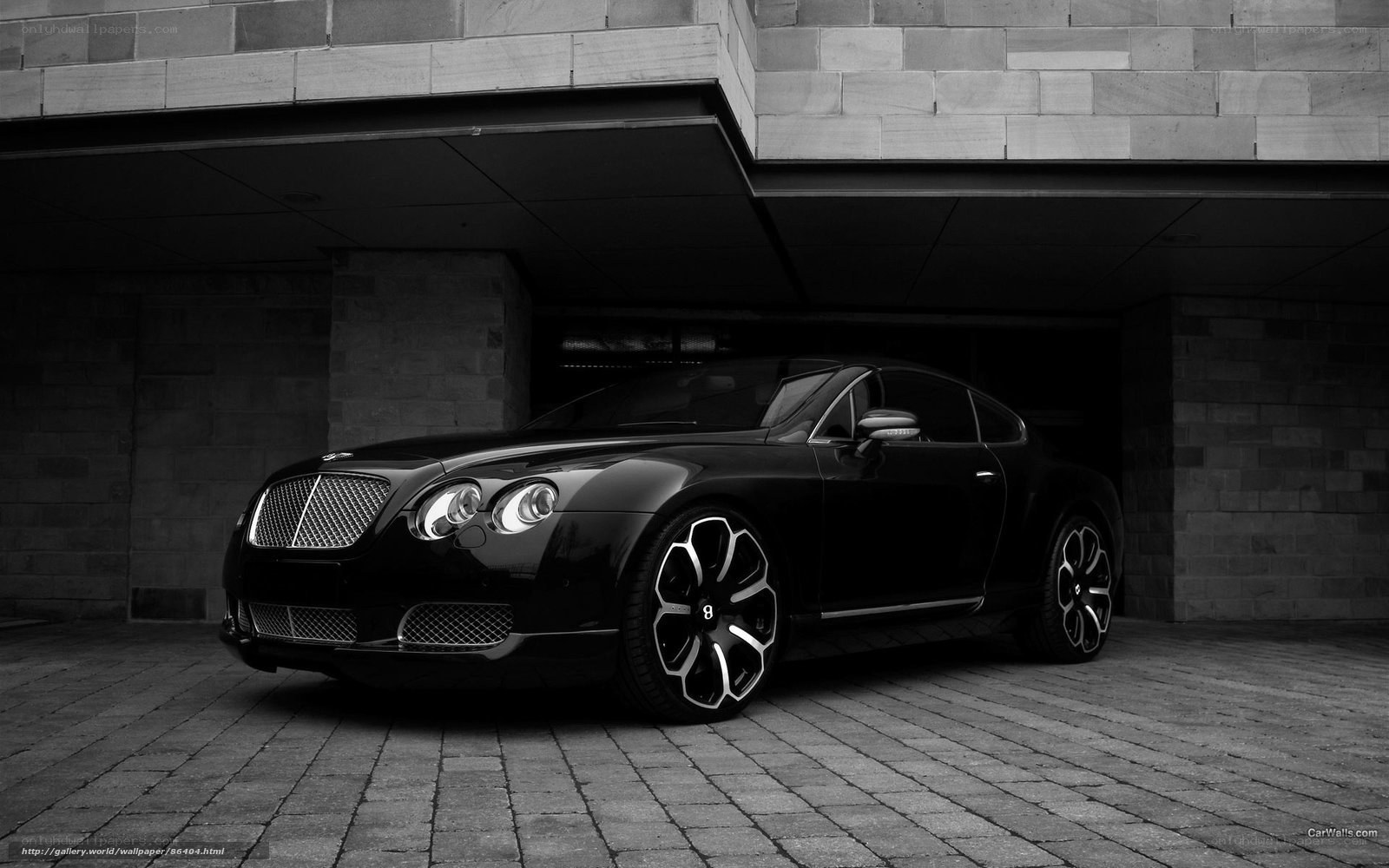 Black Bentley parked in garage