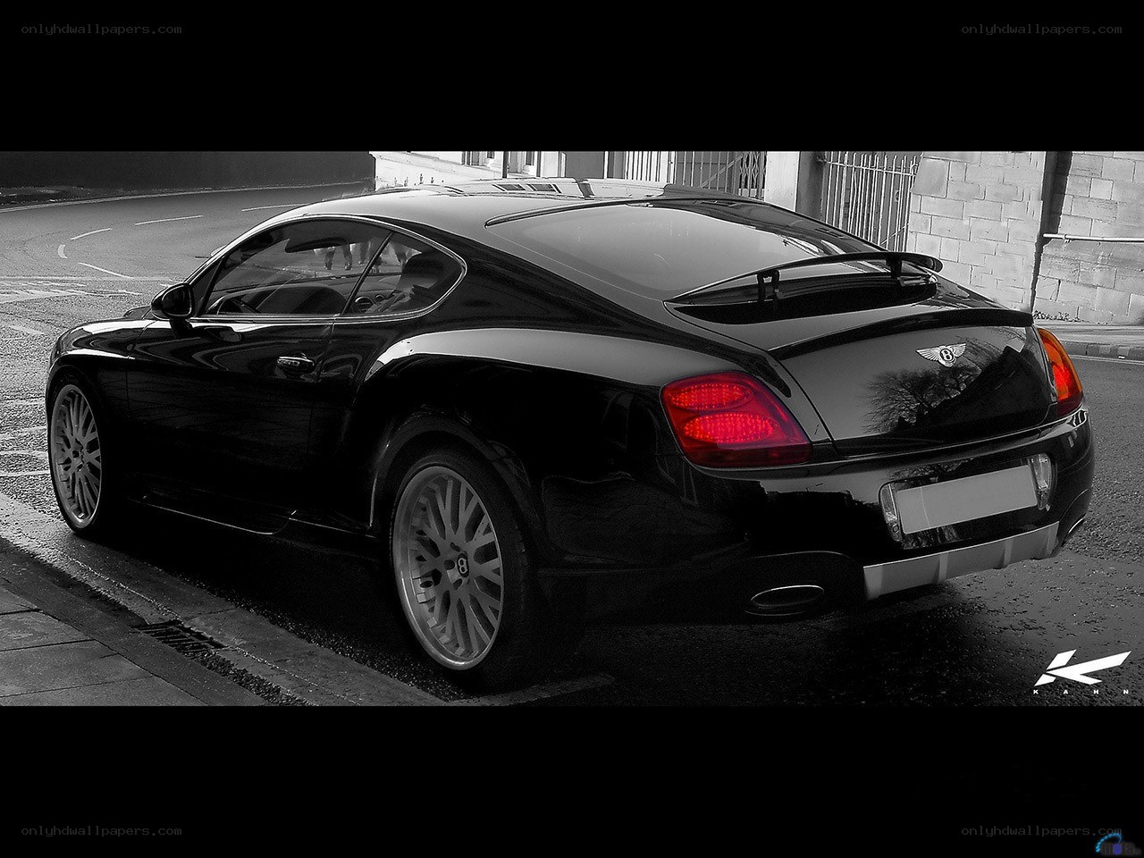 Black Bentley parked on street