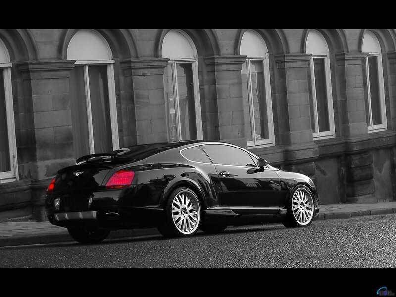 Black Bentley parked on street