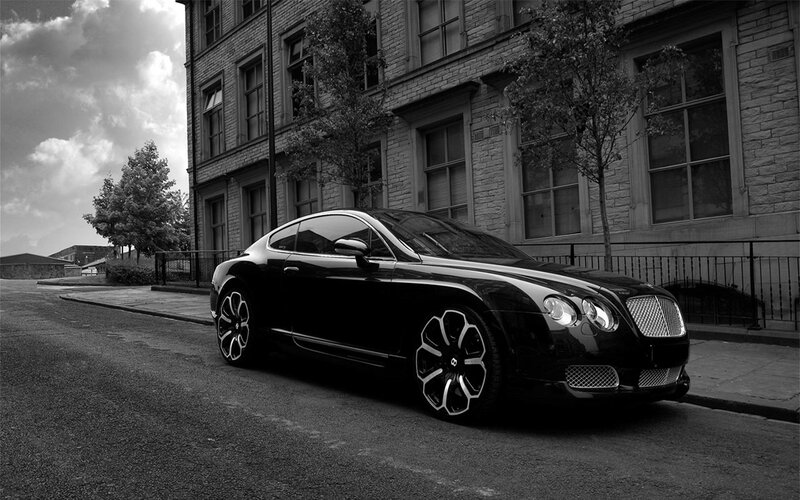 Black Bentley parked on street