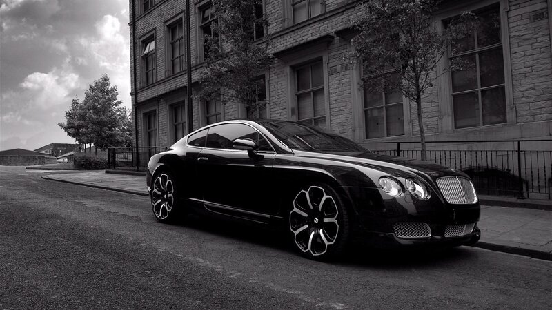 Black Bentley parked on street