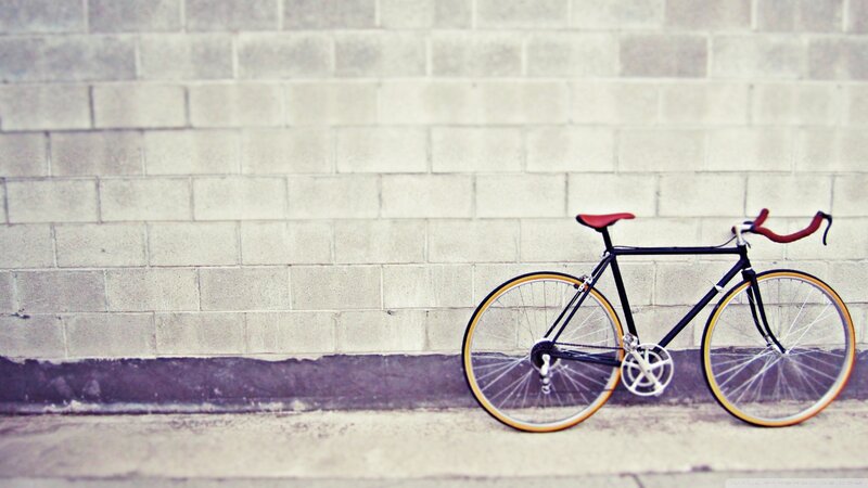 Black Bicycle Against Wall — Gray, Calm