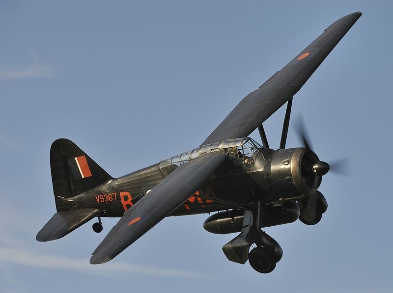 Black Biplane in Flight — Calm