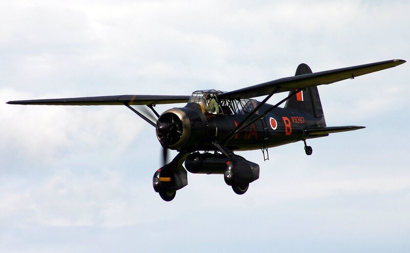 Black Biplane in Flight — Dynamic