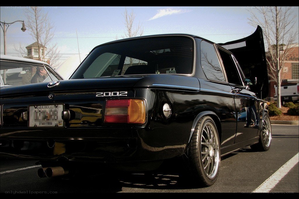 Black BMW 2002 with open hood