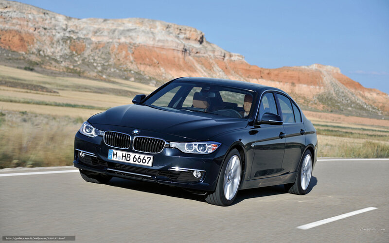 black bmw 3 series driving