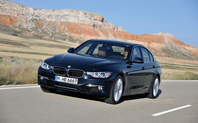 Black BMW 3 Series on a road