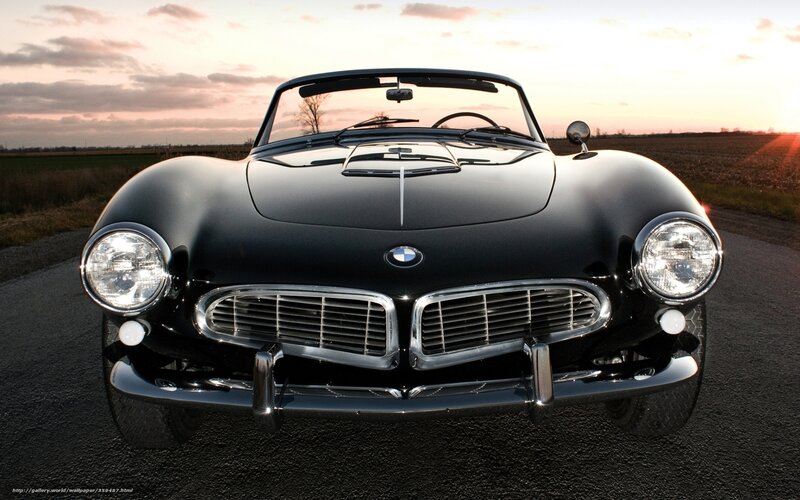 Black BMW 507 at sunset